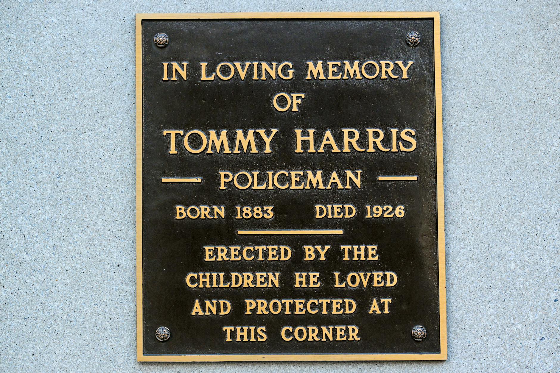 Bronze plaque in memory of Tommy Harris, erected by local children in Covington, KY.